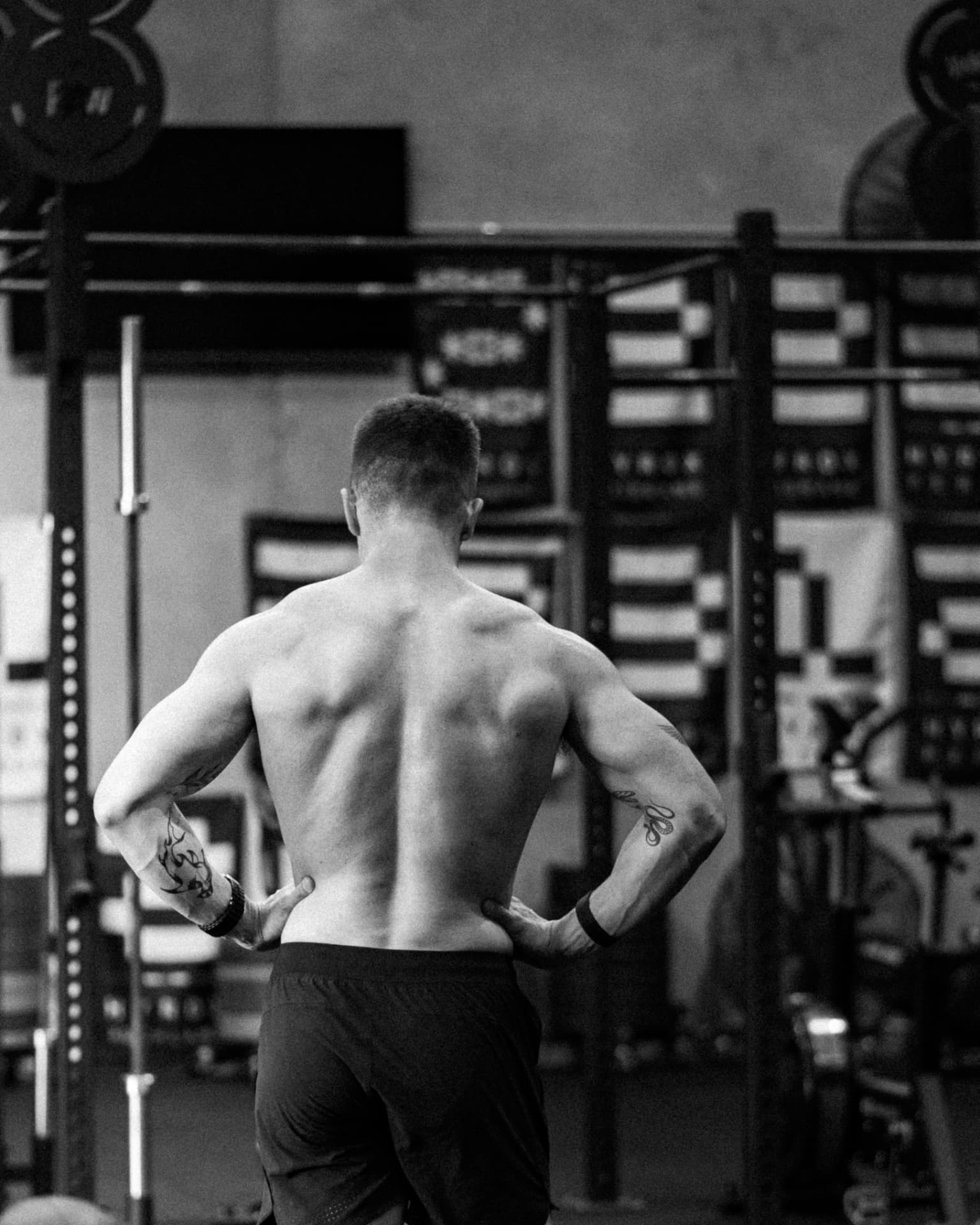 Athlete standing in a gym facing the rig