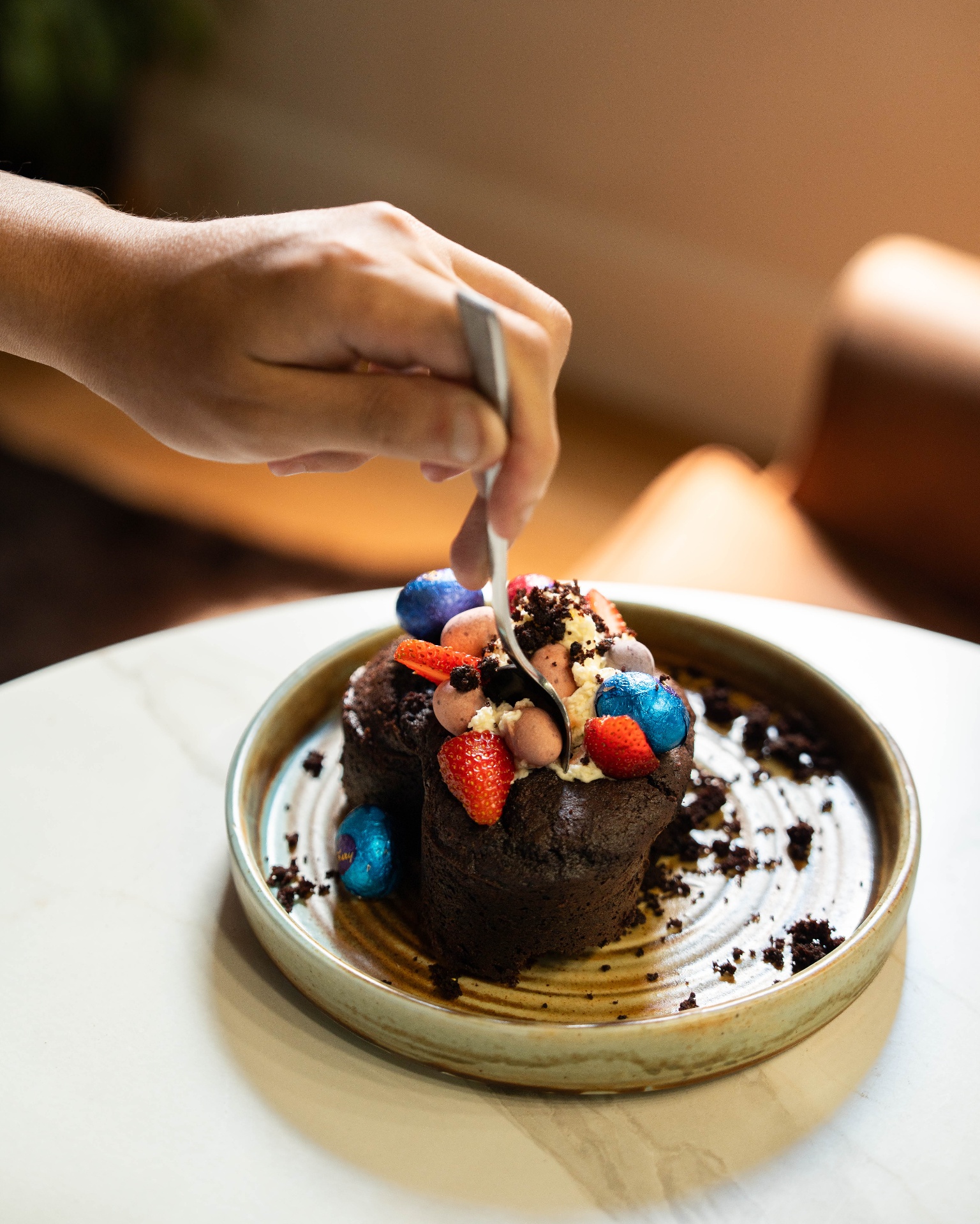 Chocolate dessert plated with strawberries