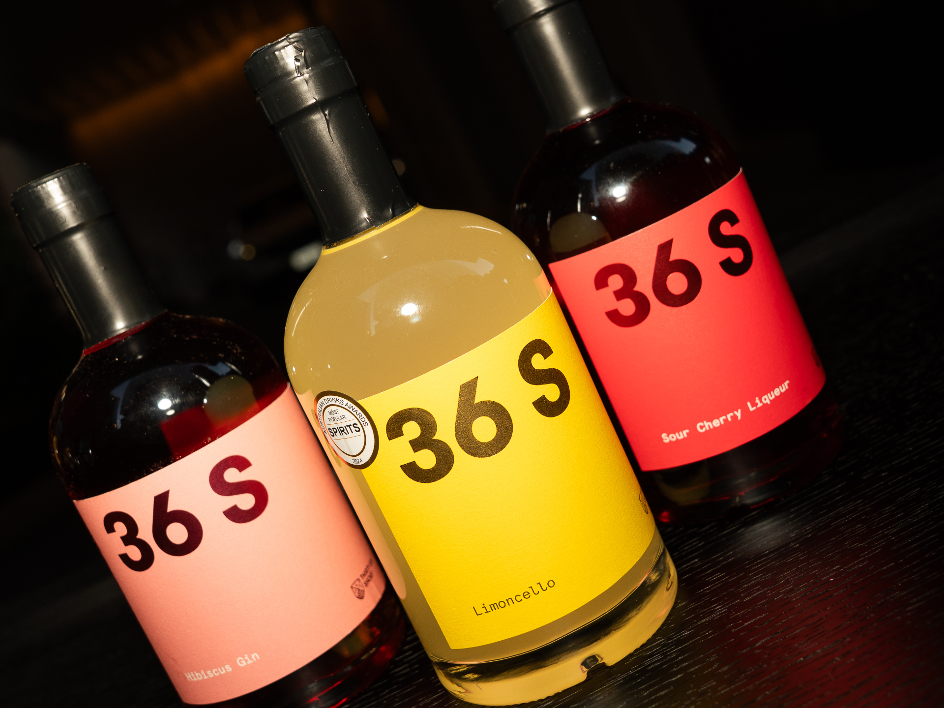 Trio of 36 Short Distillery bottles — Hibiscus Gin, Limoncello and Sour Cherry Liqueur