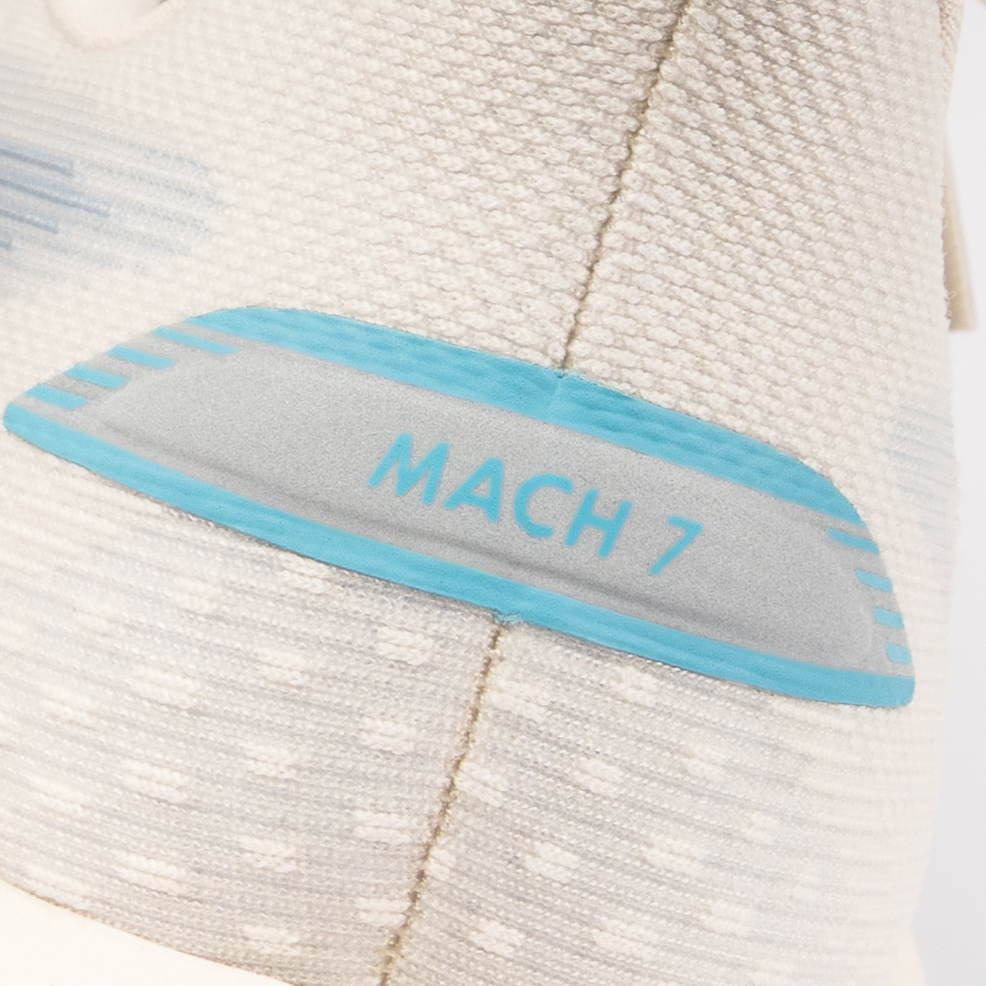 Macro detail of the Mach 7 heel tab in turquoise and silver