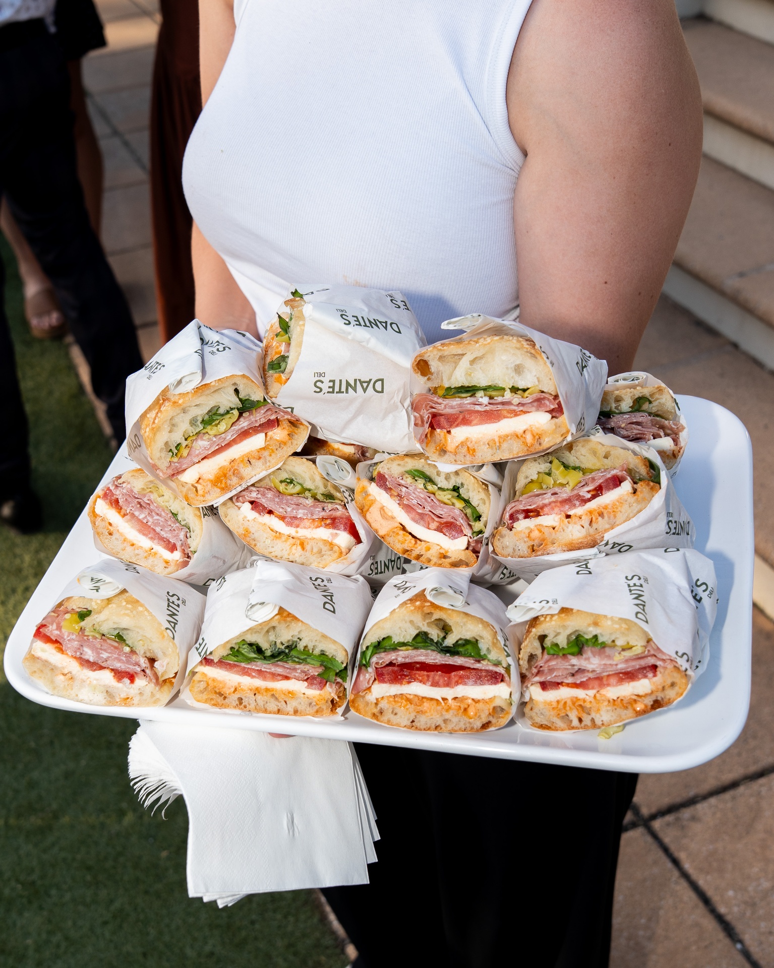 Tray of Dante's Deli sandwiches at an event
