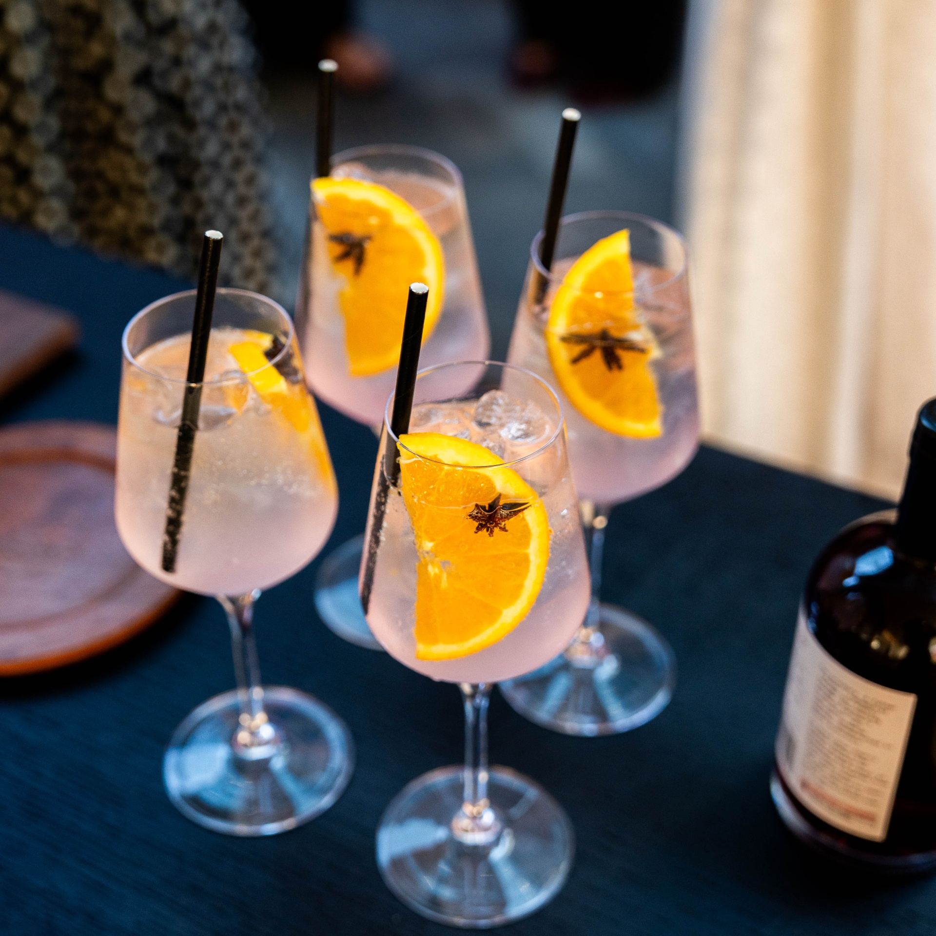 Aperol-style spritz cocktails with orange and star anise